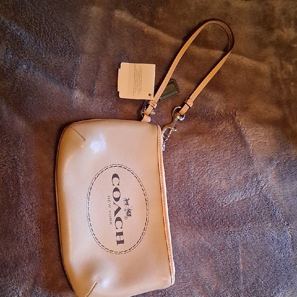 Coach Handbags - Coach Beige Wristlet with Logo